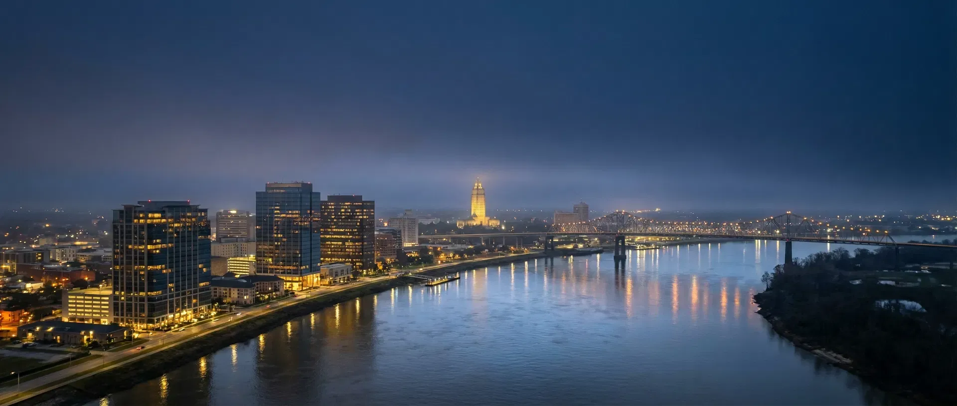 Baton Rouge skyline at night with Mississippi River and Louisiana State Capitol